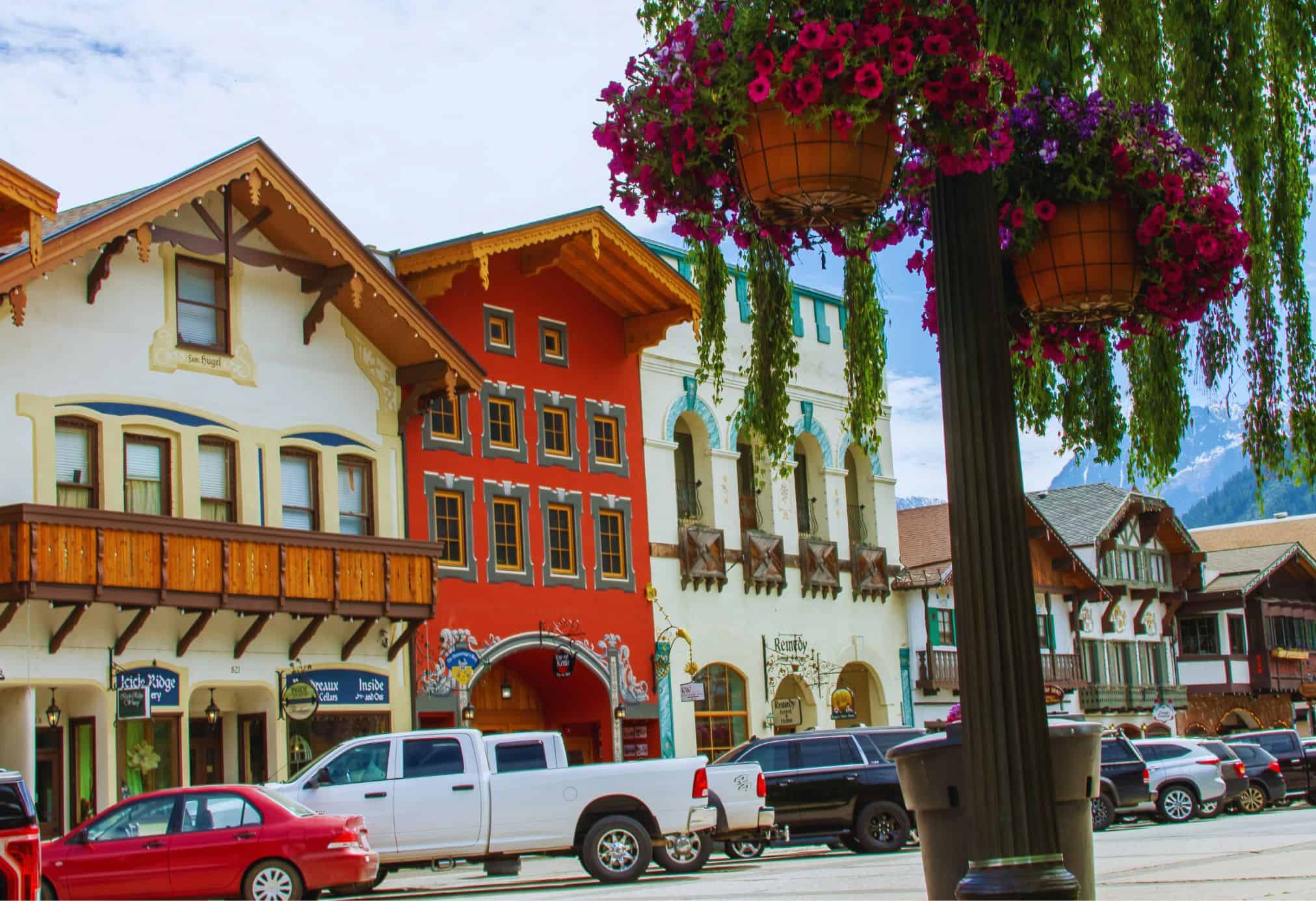 Colorful Bavarian-style buildings and hanging flower baskets in downtown Leavenworth, Washington