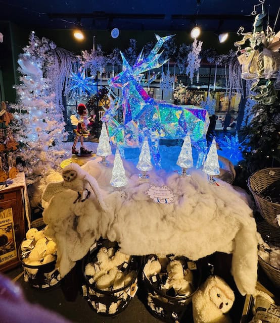 Glittering reindeer and glowing Christmas decorations inside Kris Kringl store in Leavenworth WA