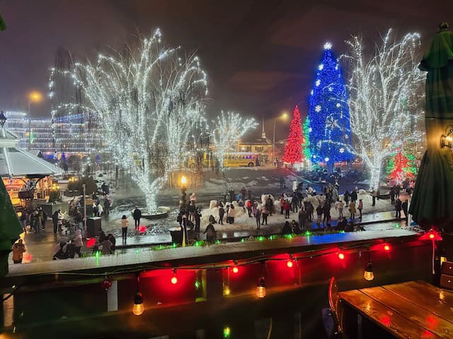 View of Leavenworth’s Village of Lights from the balcony at Mozart’s Restaurant, with glowing Christmas trees and festive downtown streets