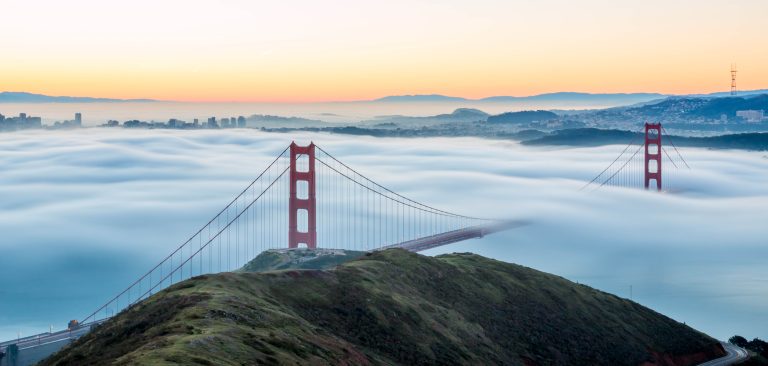 Golden Gate Bridge rising above morning fog at sunrise — one of the most unforgettable reasons San Francisco is worth visiting