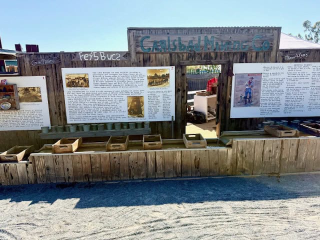 Carlsbad Mining Company sluice activity at The Flower Fields in Carlsbad California with educational display and gem mining station