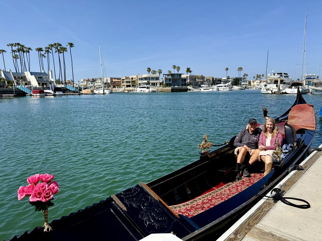 Couple enjoying a gondola ride on the water in Coronado, California