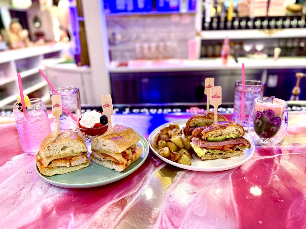 Sandwiches, breakfast potatoes, dessert, and colorful drinks at Cafe Carrusel in Santa Rosa during a mother daughter weekend in Mendocino